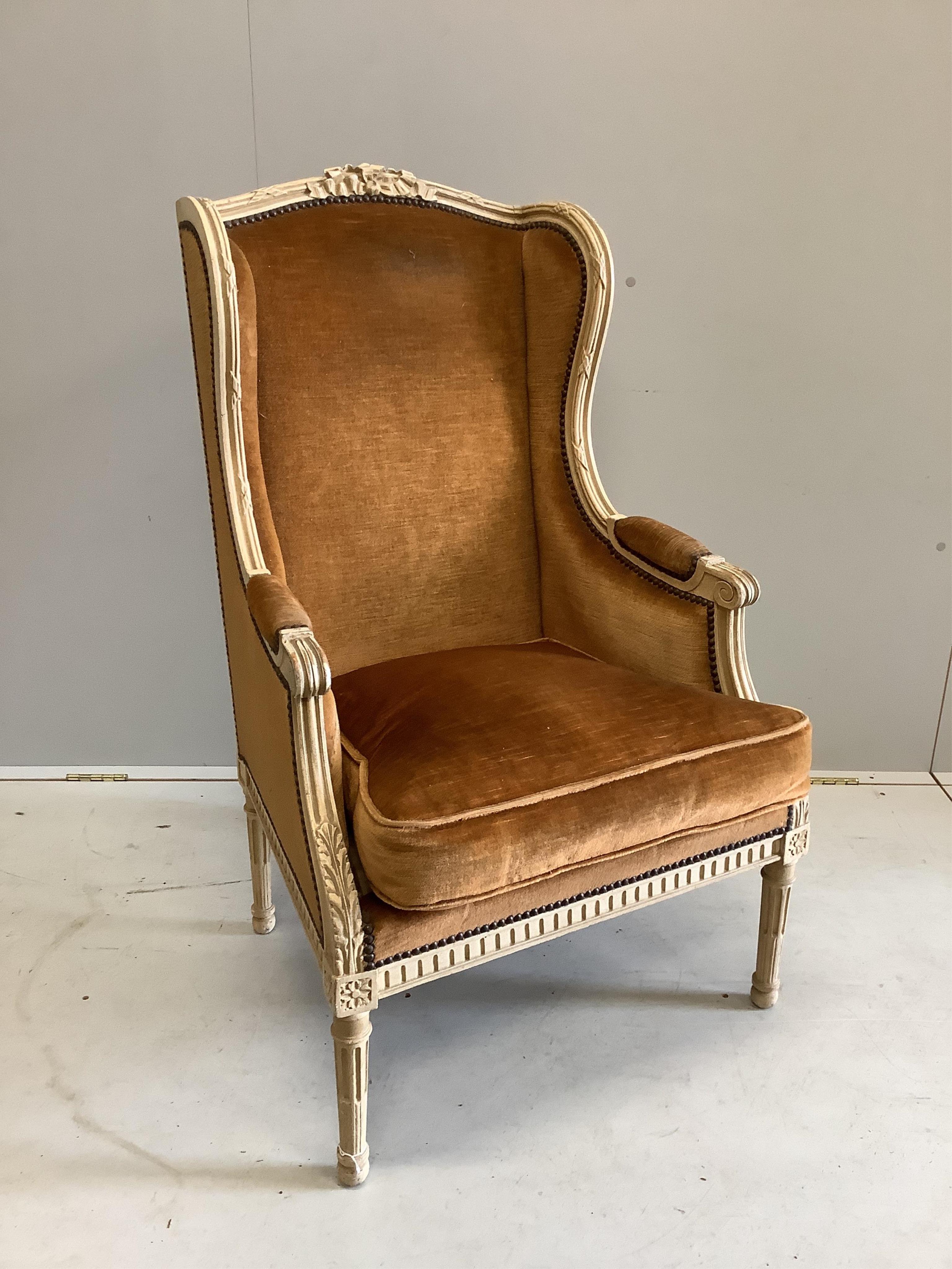 A Louis XVI style cream painted fauteuil, width 64cm, height 74cm. Condition - fair